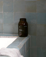 Onsen Bath Salts beside a warm bath