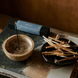 Earl of East Japanese incense sticks burning in a minimalist home setting with soft natural lighting