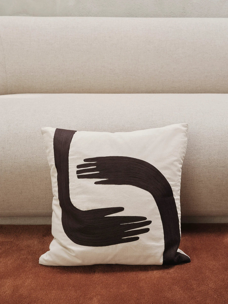 Pose Cushion by ferm LIVING, on a sofa