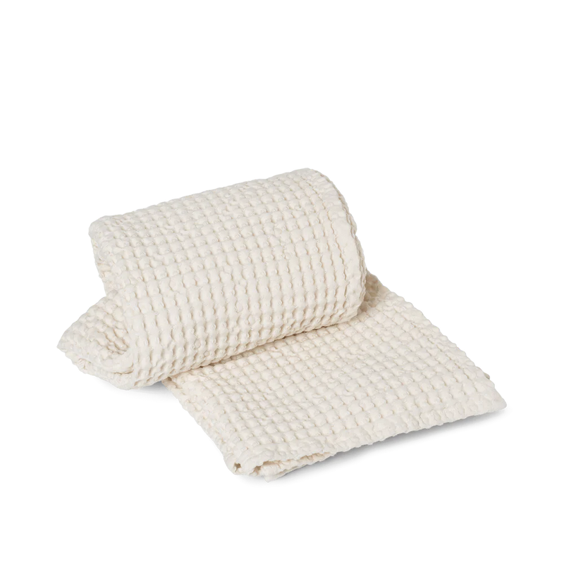  Organic Bath Towel, Off White by ferm LIVING, rolled 