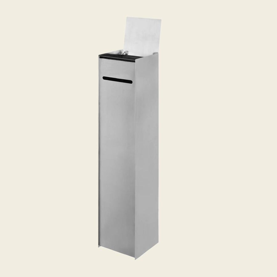Sama Toilet Paper Dispenser, Brushed Stainless Steel by ferm LIVING, on a cream background