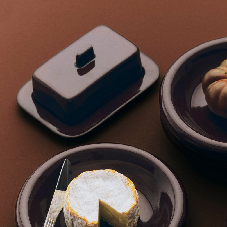 Barro Butter Dish, Burgundy by HAY, with cheese on a dark table