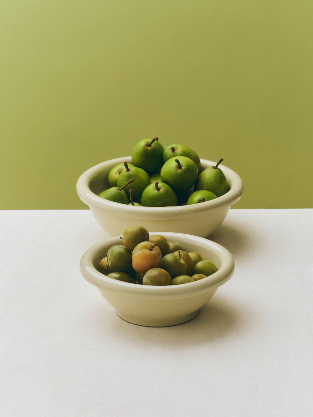 Barro Salad Bowl, Small, Pistachio by HAY, filled with olives on a pistachio backdrop