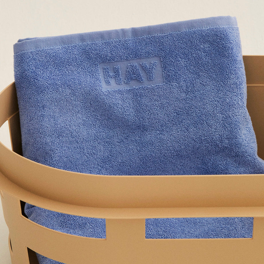 Mono Wash Cloth, Sky Blue by HAY, in a basket