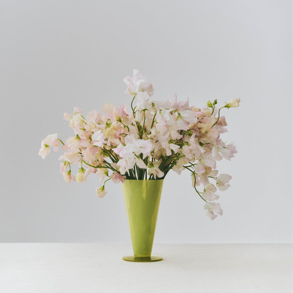 Conical Vase, Small, Light Green by HAY, holding white blossom