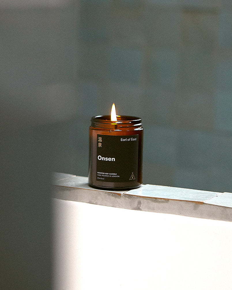 Onsen Scented Candle, 170ml by Earl of East, lit in a bathroom