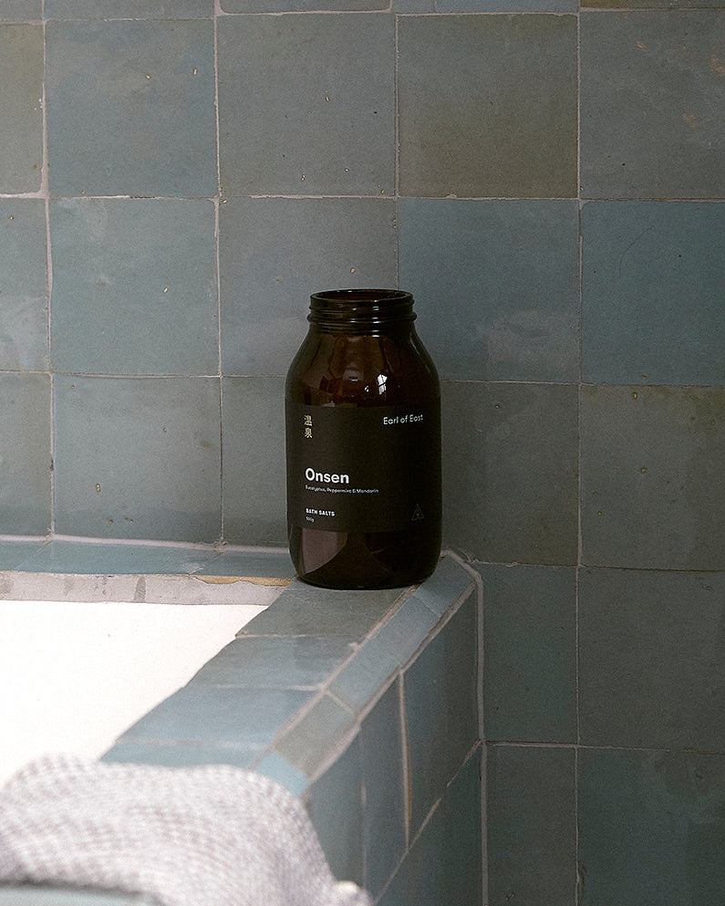Onsen Bath Salts beside a warm bath