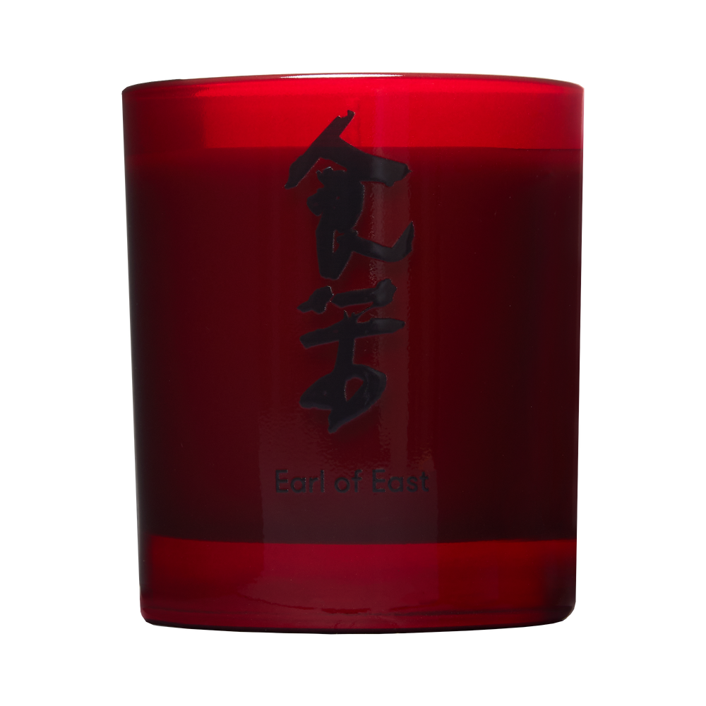 Bone Broth Scented Candle by Eat Bitter, in a red glass vessel