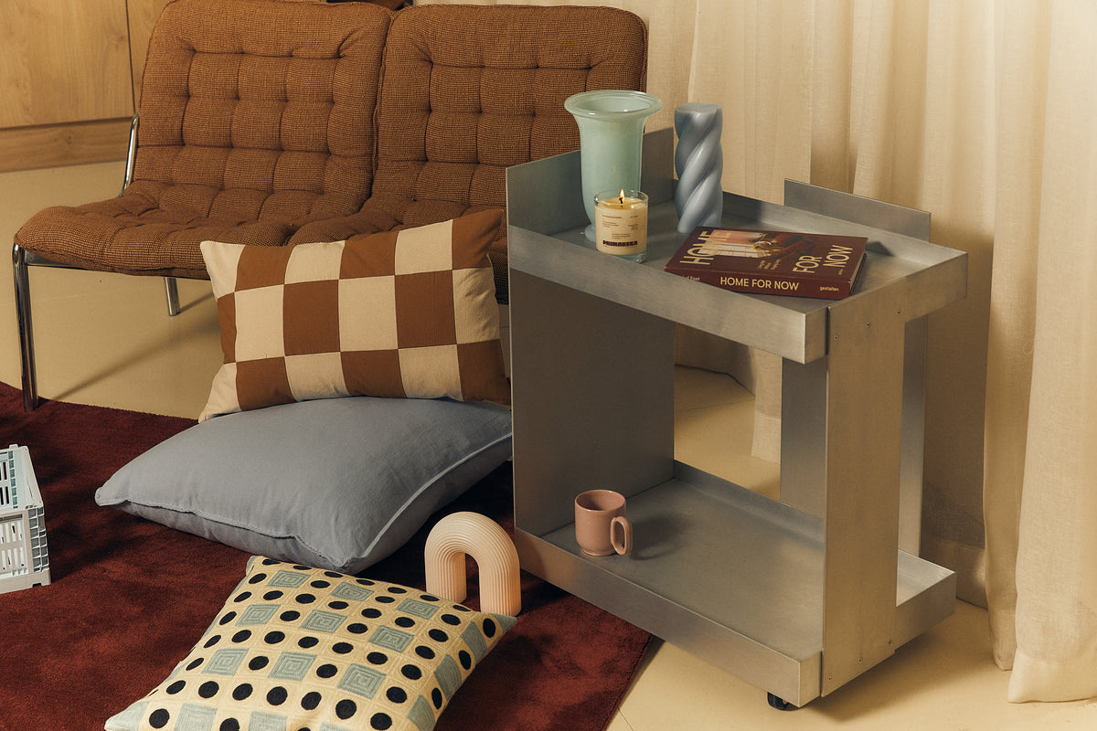 Living room with a checked sofa and side table