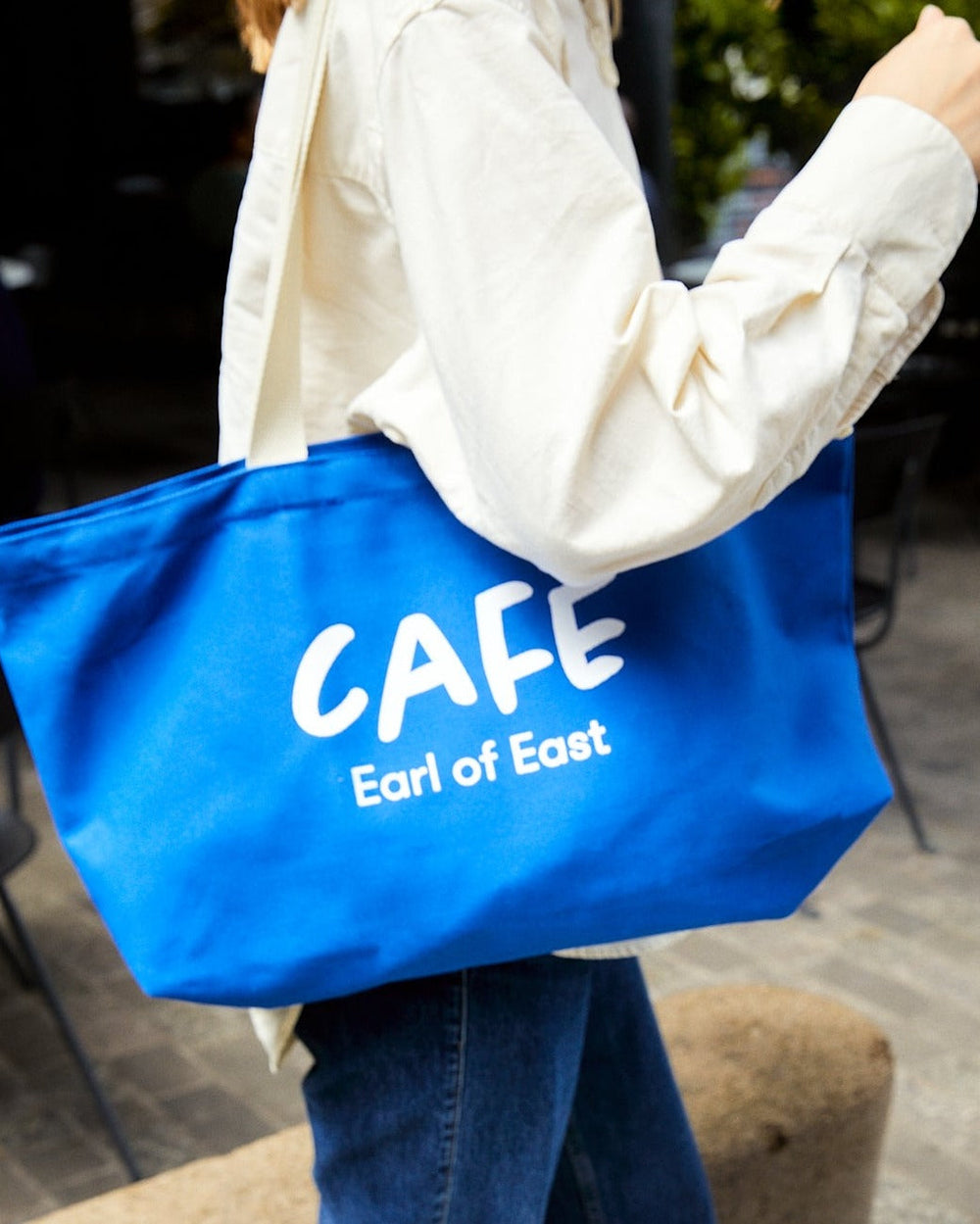 Café Canvas Market Bag, Blue by Earl of East, carried over the shoulder