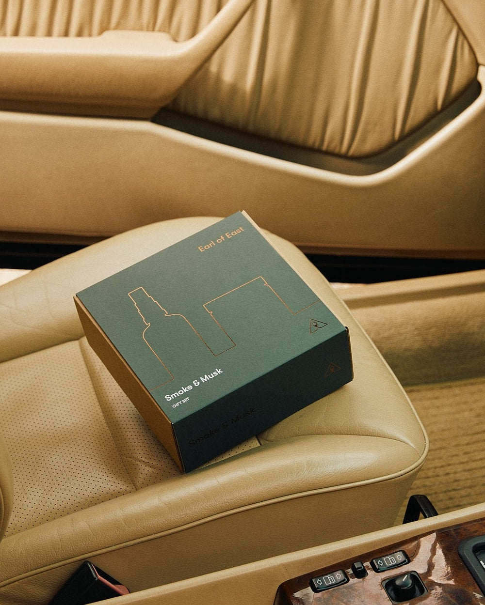 Smoke & Musk Duo Gift Set by Earl of East, gift box on a leather car seat