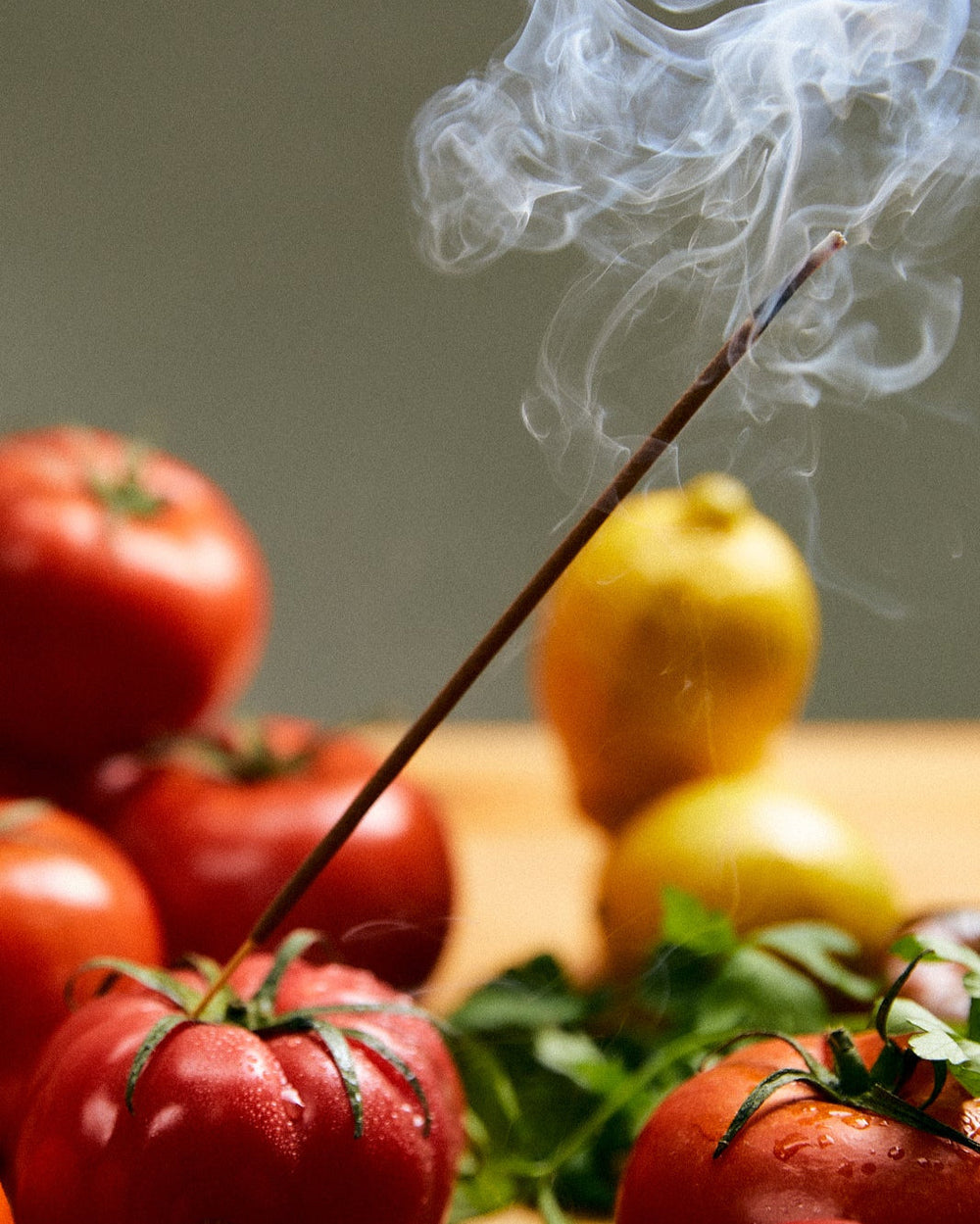 Greenhouse Incense Sticks by Earl of East, burning among tomatoes and lemons