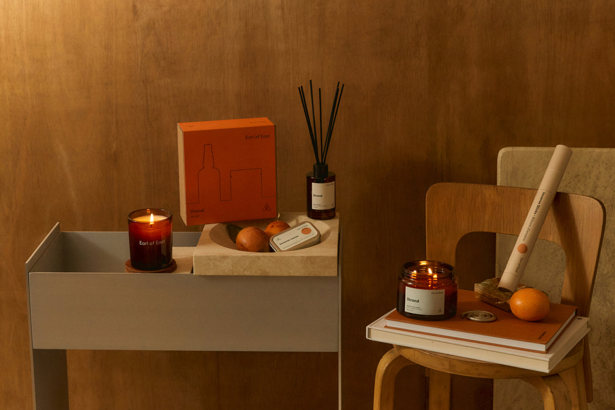 Earl of East Strand products on a shelf in a wood-panelled room