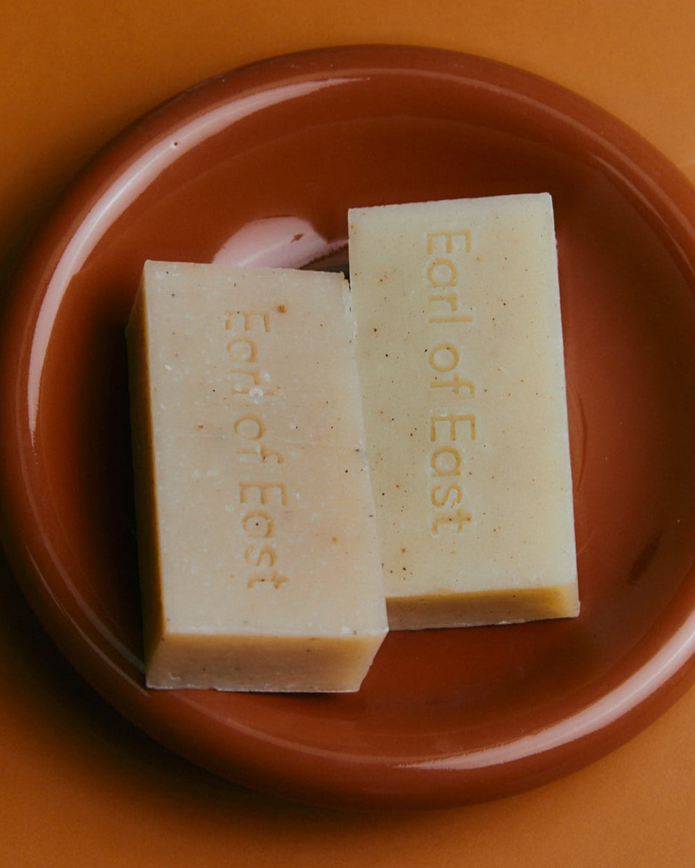 Atlas Cedar Cleansing Bar Soap, 160g by Earl of East, on a terracotta dish