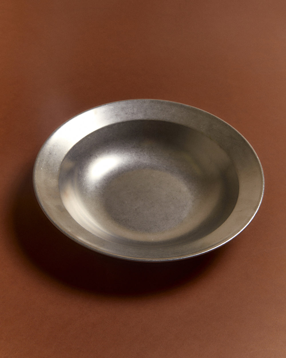 Large Serving Bowl, Vintage Stainless Steel by Earl of East, on a rust background