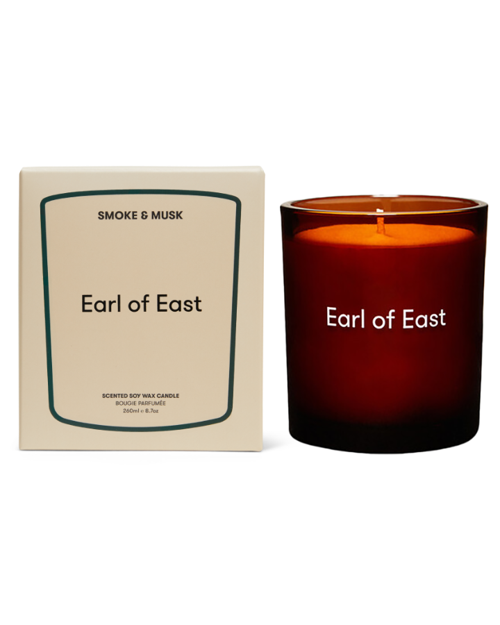  Smoke & Musk Scented Candle, 260ml by Earl of East, lit beside its box 