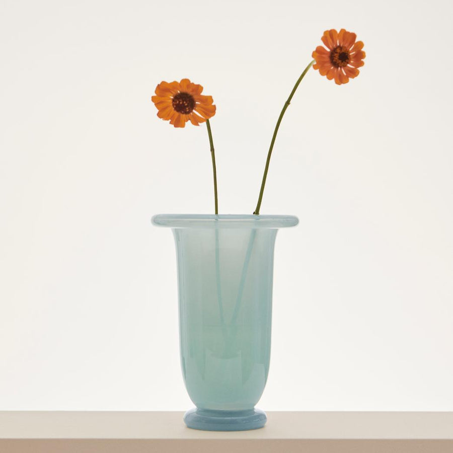 Empire Vase, Medium, Light Blue by HAY, holding an orange flower