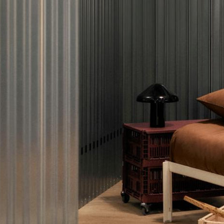 Colour Crate, Medium, Bordeaux by HAY, in a dark room