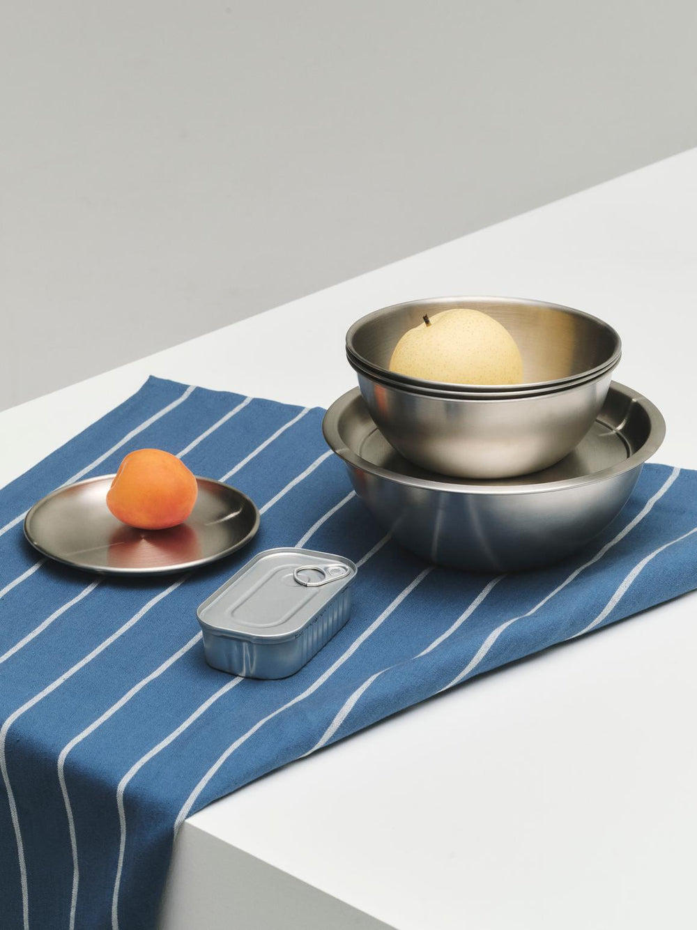 Outdoor Market Tea Towel, Set of 2, Blue & Beige by HAY, on a table with metal bowls