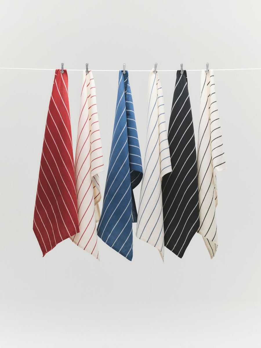 Outdoor Market Tea Towel, Set of 2, Red & Beige by HAY, hanging in a range of colours