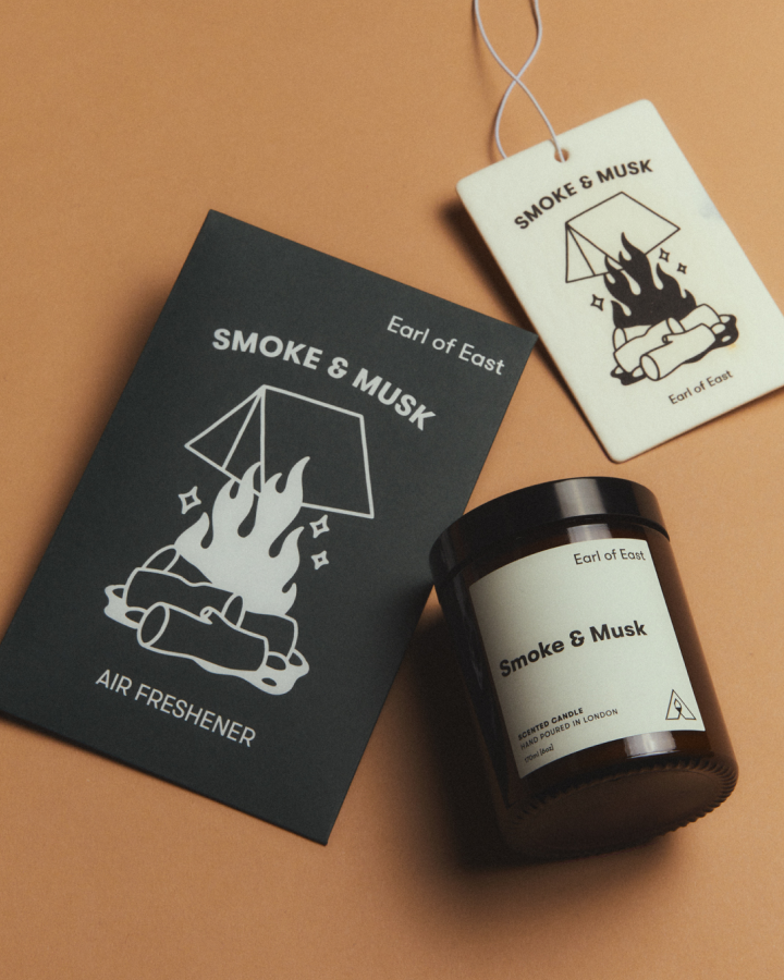 Smoke & Musk Starter Scent Set by Earl of East, with its green box on tan