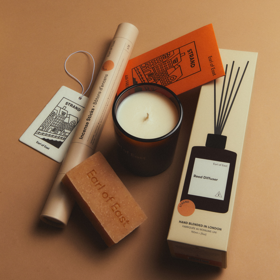 The Signature Scent Bundle, Strand by Earl of East, laid out on tan
