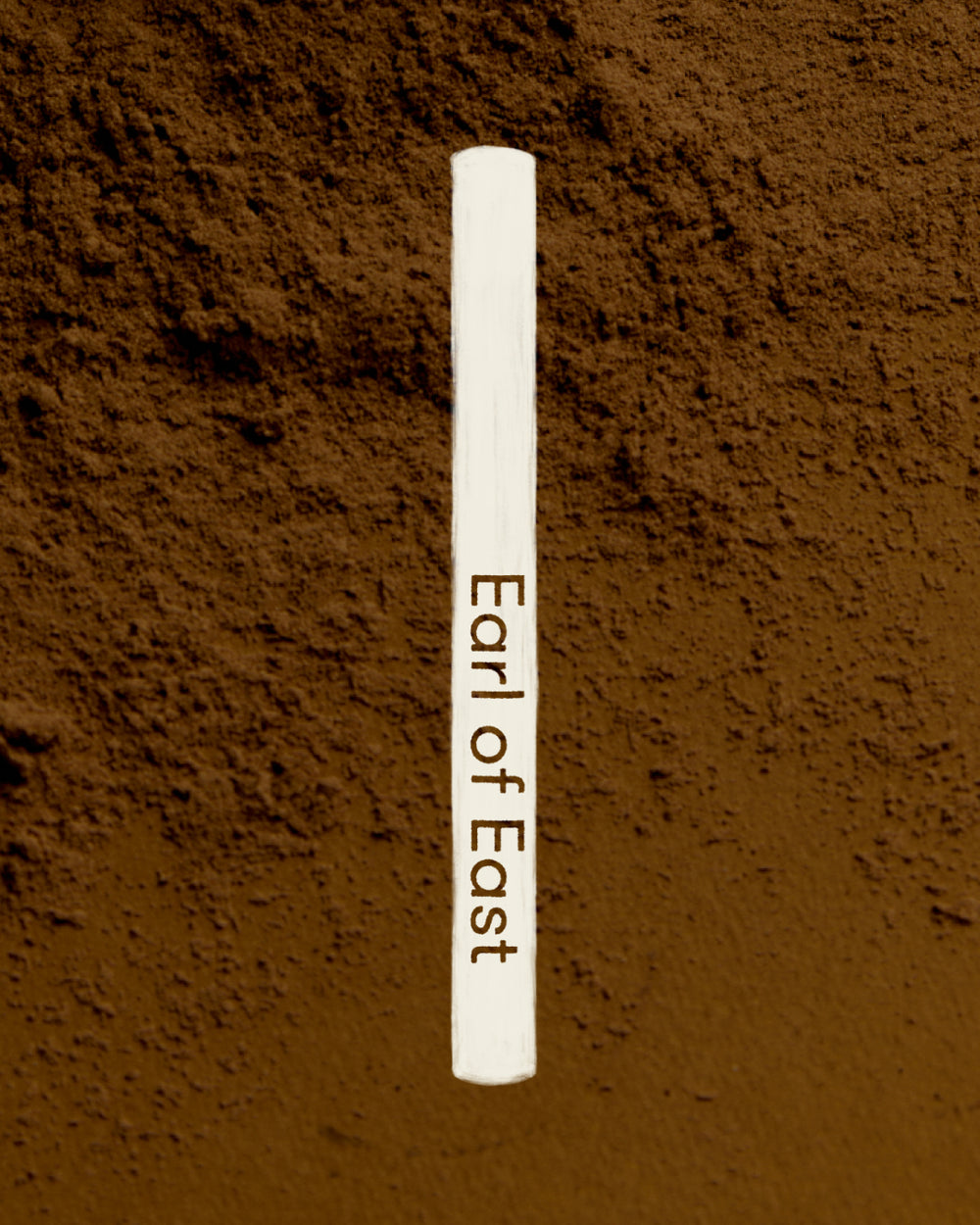 Atlas Cedar Incense Sticks by Earl of East, tube on brown earth