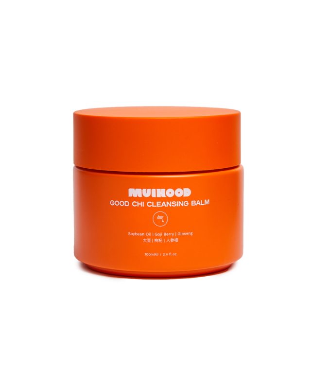 A travel size container of Muihood Good Chi Cleansing Balm in orange color.