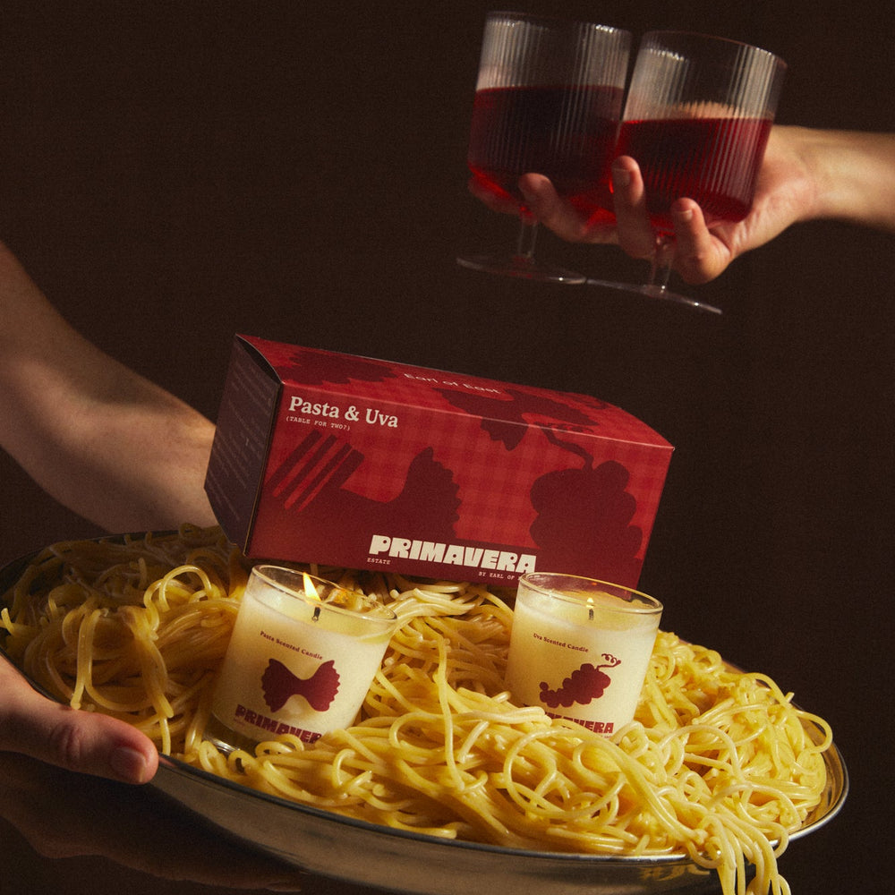 Pasta & Uva Votive Candle Set, 2 x 75ml by Earl of East, on a table with pasta and red wine