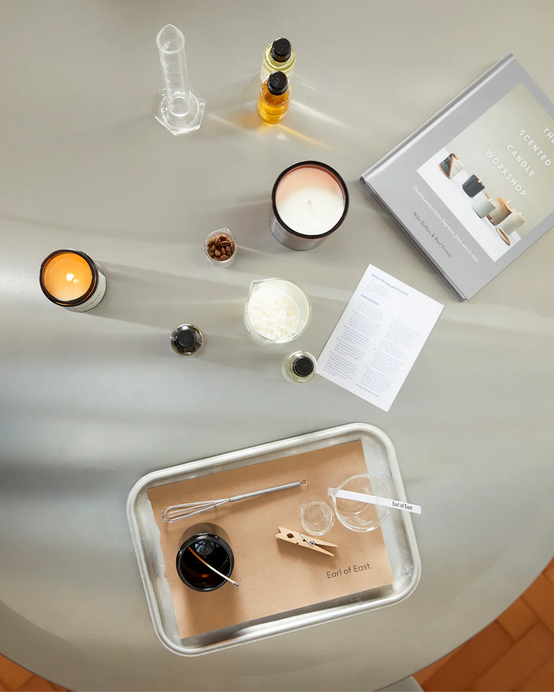  Earl of East candle making workshop materials on a white table 