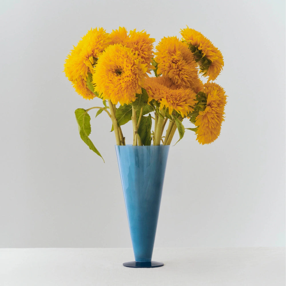 Conical Vase, Large, Blue by HAY, holding yellow flowers