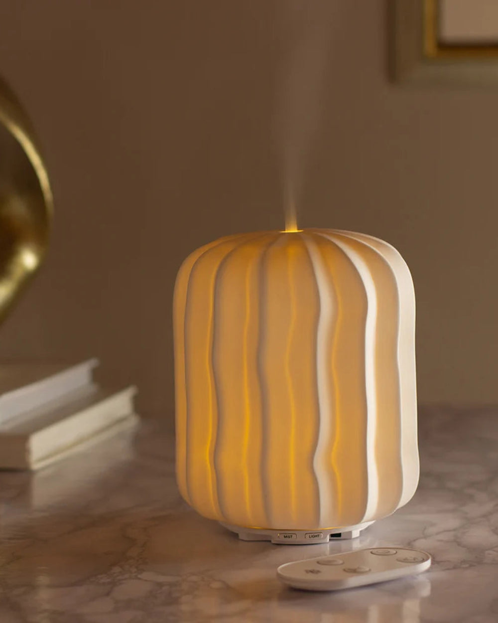 Lina Aroma Diffuser by Made by Zen, lit in a warm room