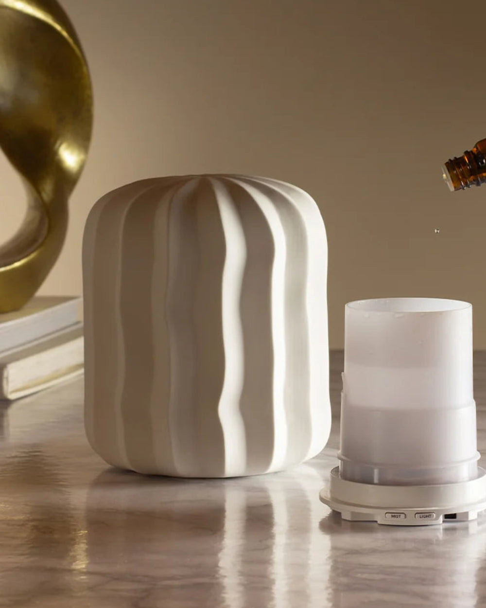 Lina Aroma Diffuser by Made by Zen, on a beige shelf