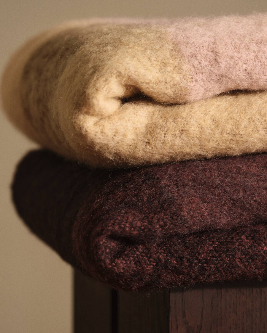 Ferm Living Blur mohair blankets folded in a stack