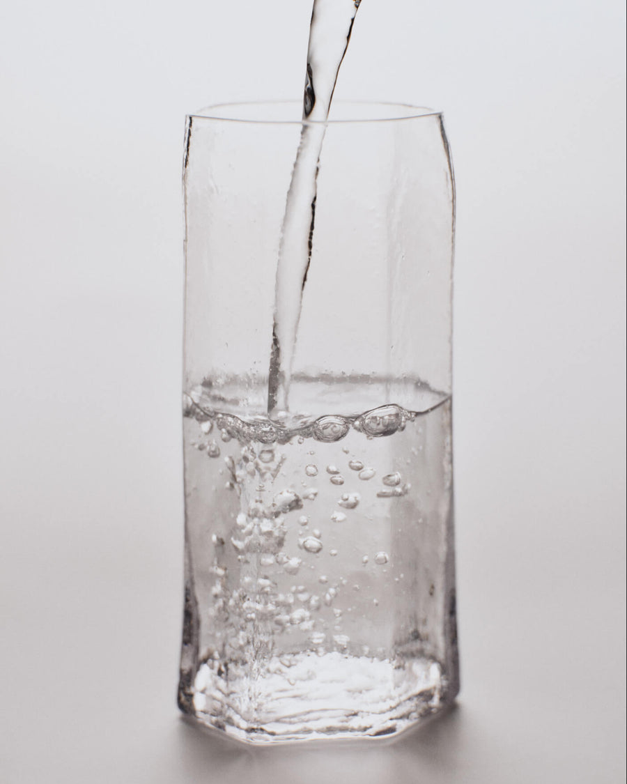 Kiru Tall Glasses, Set of 2, Clear by ferm LIVING, with water being poured