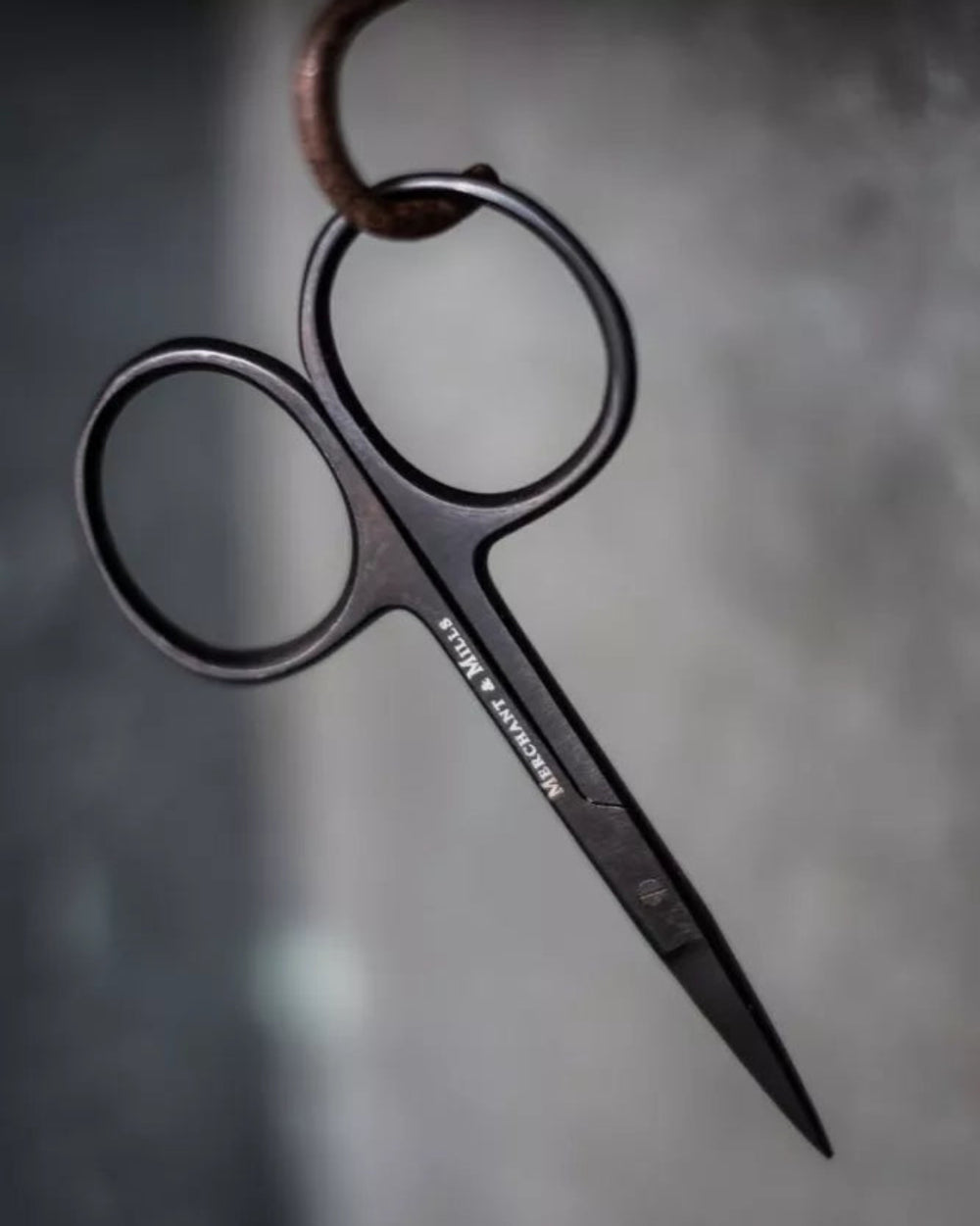 Wide Bow Scissors by Merchant and Mills, on a grey background