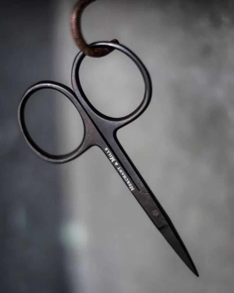 Wide Bow Scissors by Merchant and Mills, on a grey background
