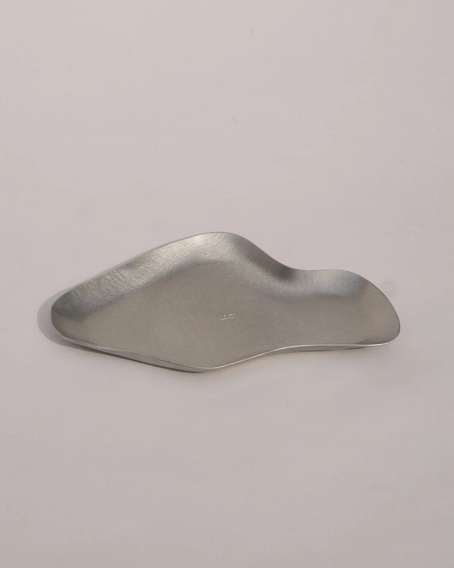 Dream/Reality Trinket Tray, Aluminium by Six Dots Design, on a pale background