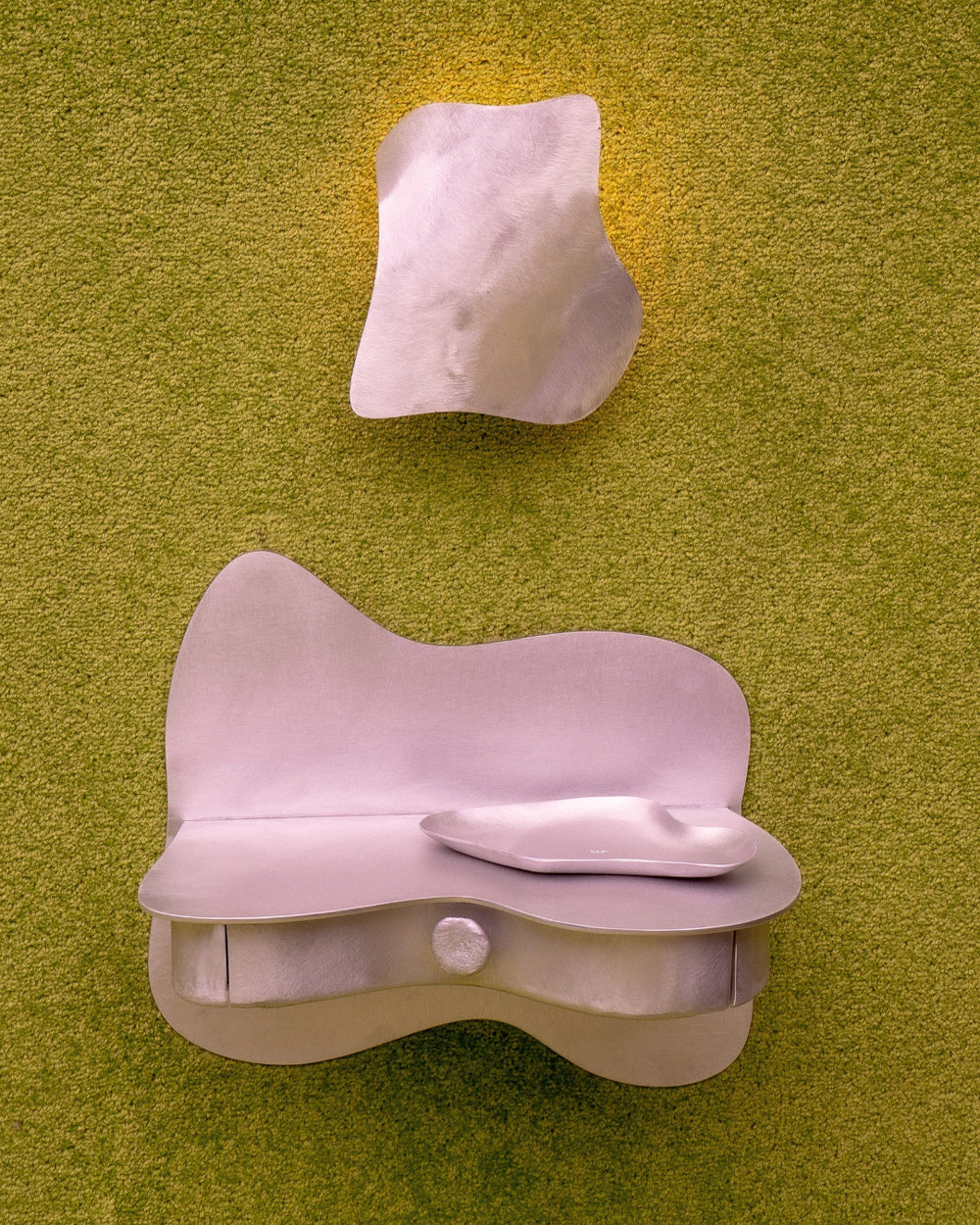 Dream/Reality Trinket Tray, Aluminium by Six Dots Design, in pink on a green backdrop