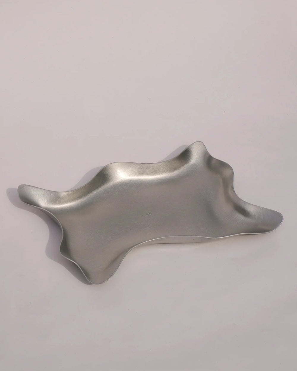 Paper Tray, Aluminium by Six Dots Design, on a grey background