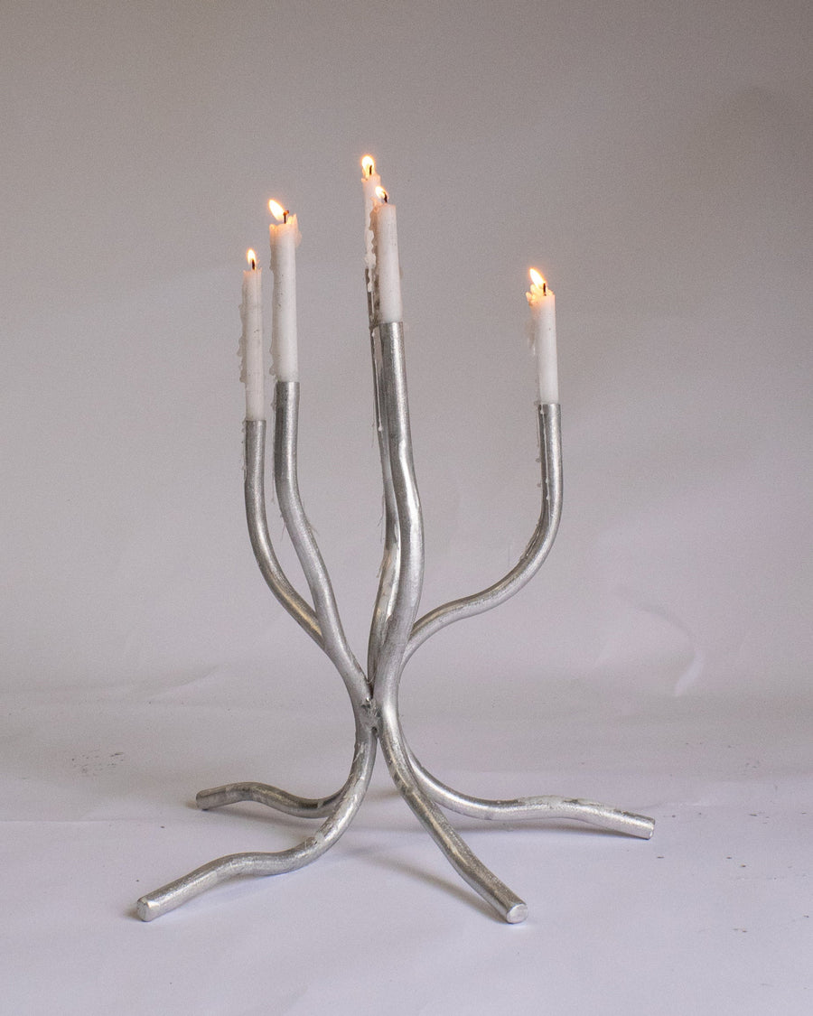 Small Candelabra, Aluminium by Six Dots Design, holding lit tapers