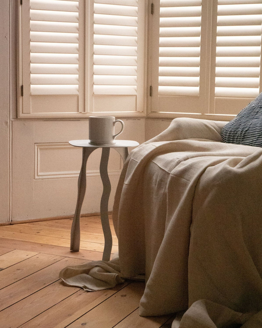 Stool 02, Aluminium by Six Dots Design, in a sunlit bedroom