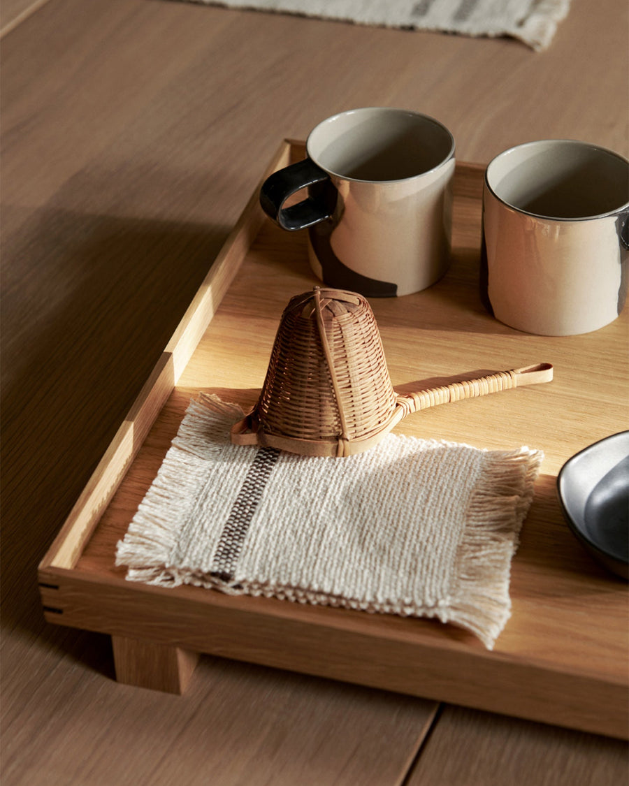 Bon Wooden Tray, Small, Oak by ferm LIVING, holding mugs and a towel