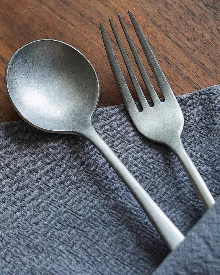 Stonewashed Stainless Steel Cutlery by Gohobi, on a grey napkin