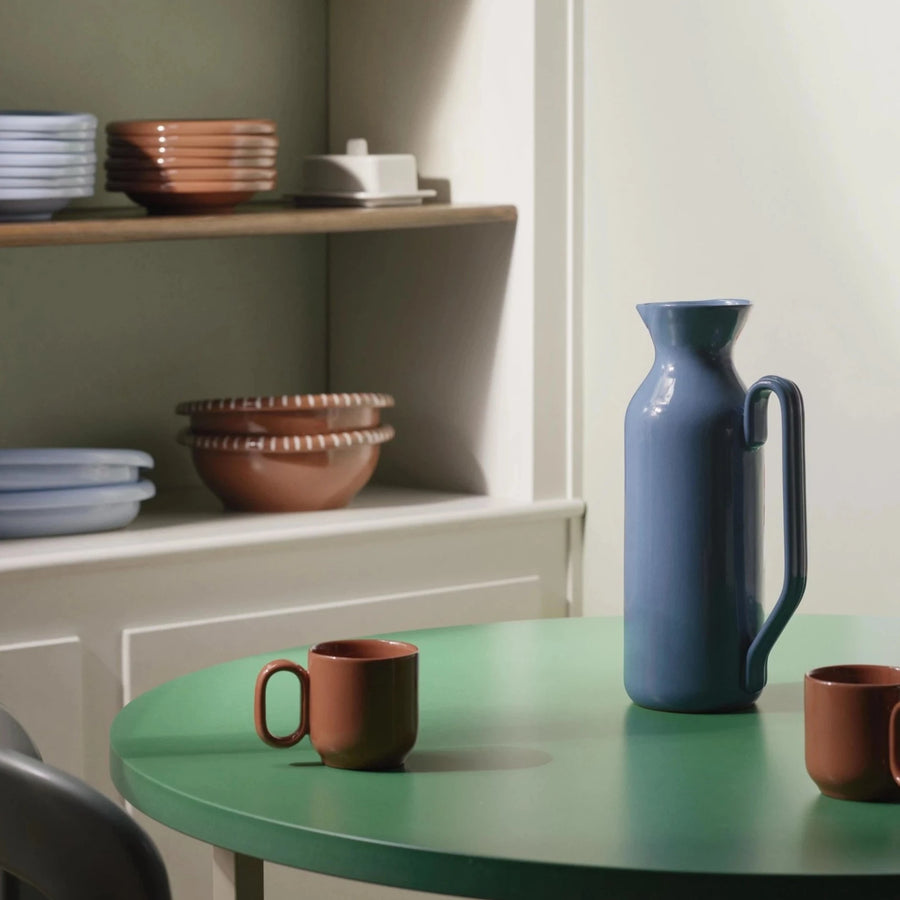Barro Jug, Tall, Dark Blue by HAY, on a green table in a kitchen