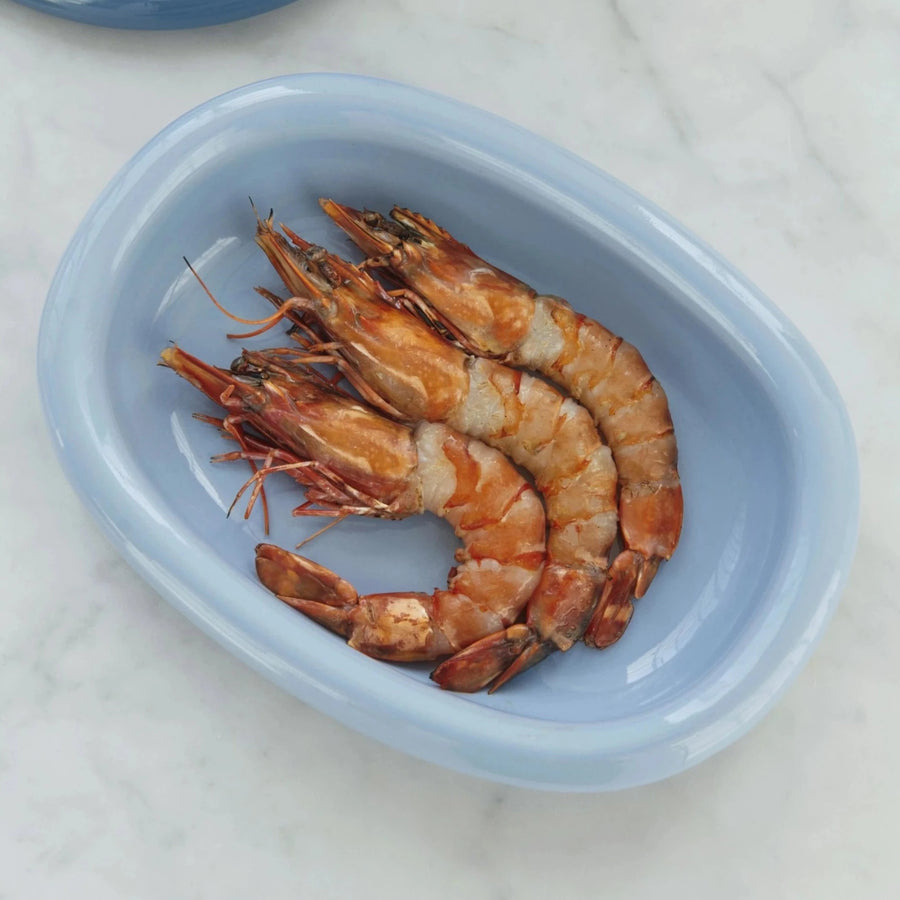 Barro Oval Dish, Small, Light Blue by HAY, holding cooked prawns