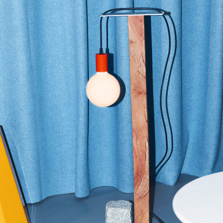 Heavy Light by Mitre & Mondays, against a blue curtain
