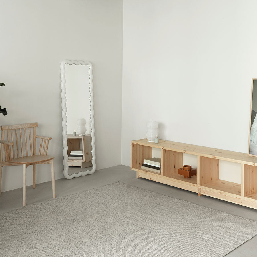 Fyr Bookcase, Pine, Medium by Normann Copenhagen, in a white room