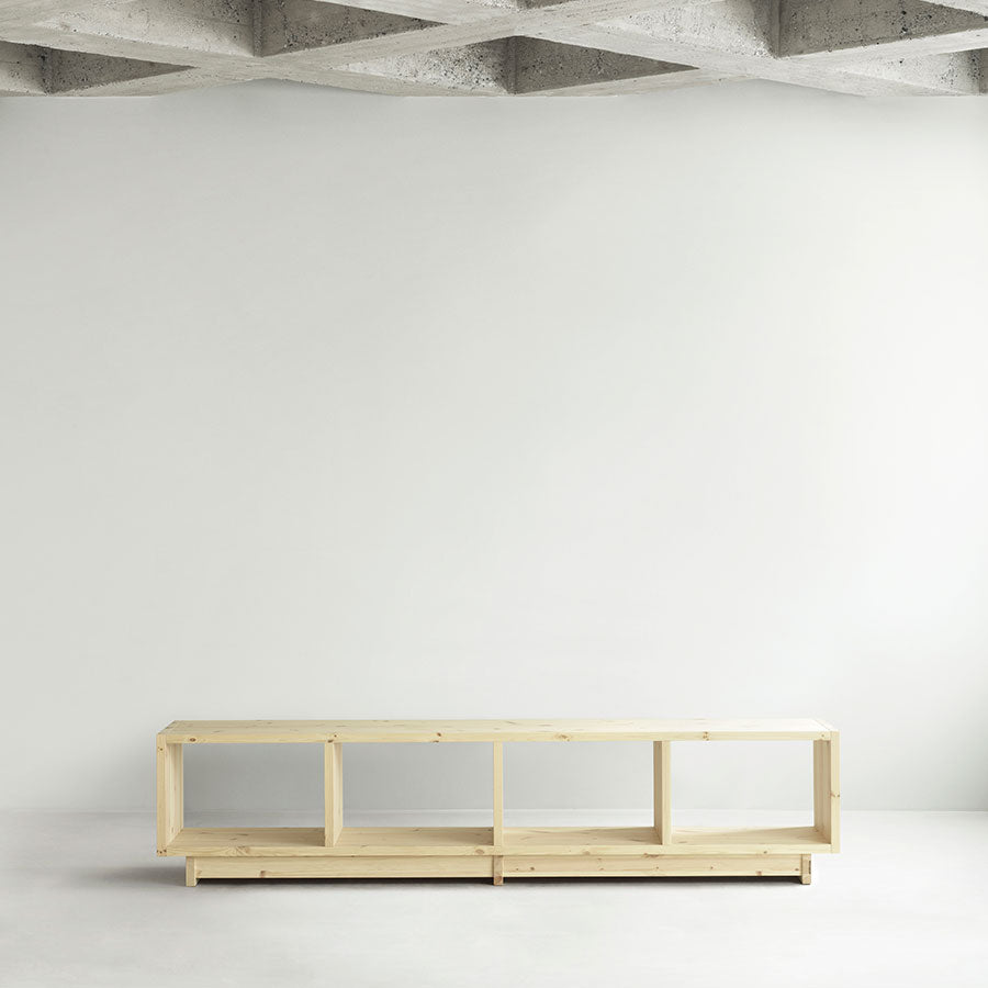 Fyr Bookcase, Pine, Low by Normann Copenhagen, in a white room