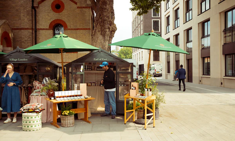 Earl of East market stall at Chelsea under green umbrellas